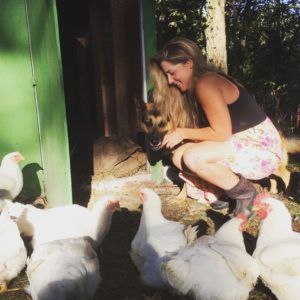 Lauren with her hens and dog Roger