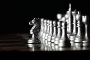 Pieces on chess board for playing game and strategy knight kingdom gaming