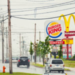 McDonald's and Burger King signs side by side