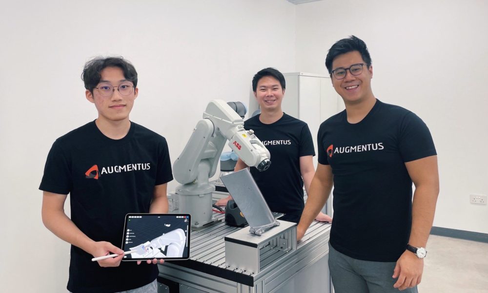 Augmentus team with robot arm