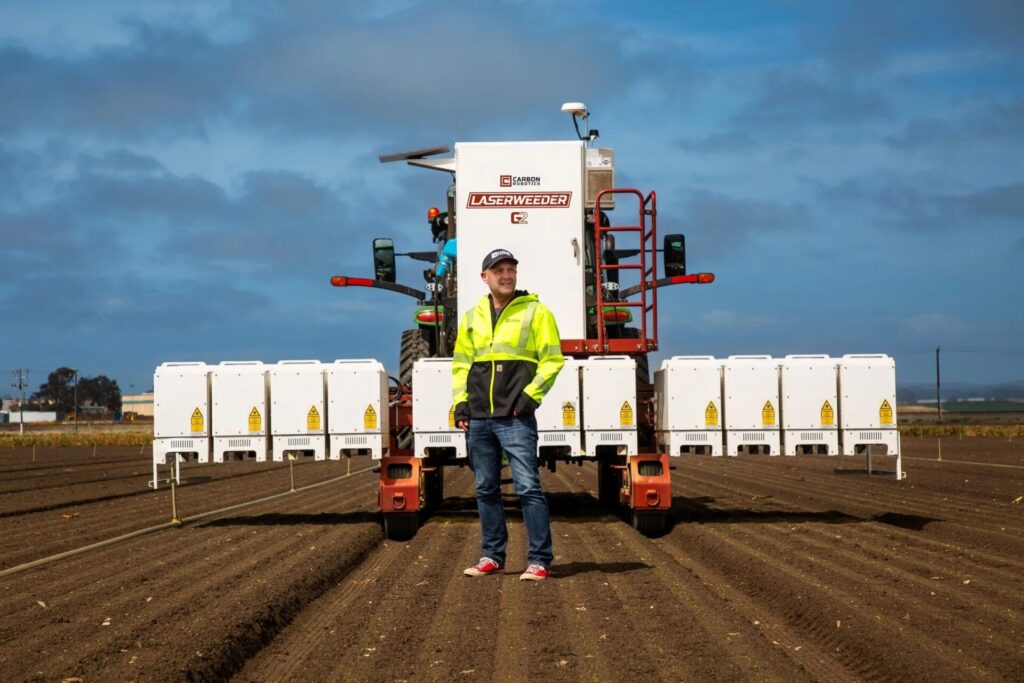 Paul Mikesell, founder and CEO of Carbon Robotics, with the G2 LaserWeeder. Image credit: Carbon Robotics